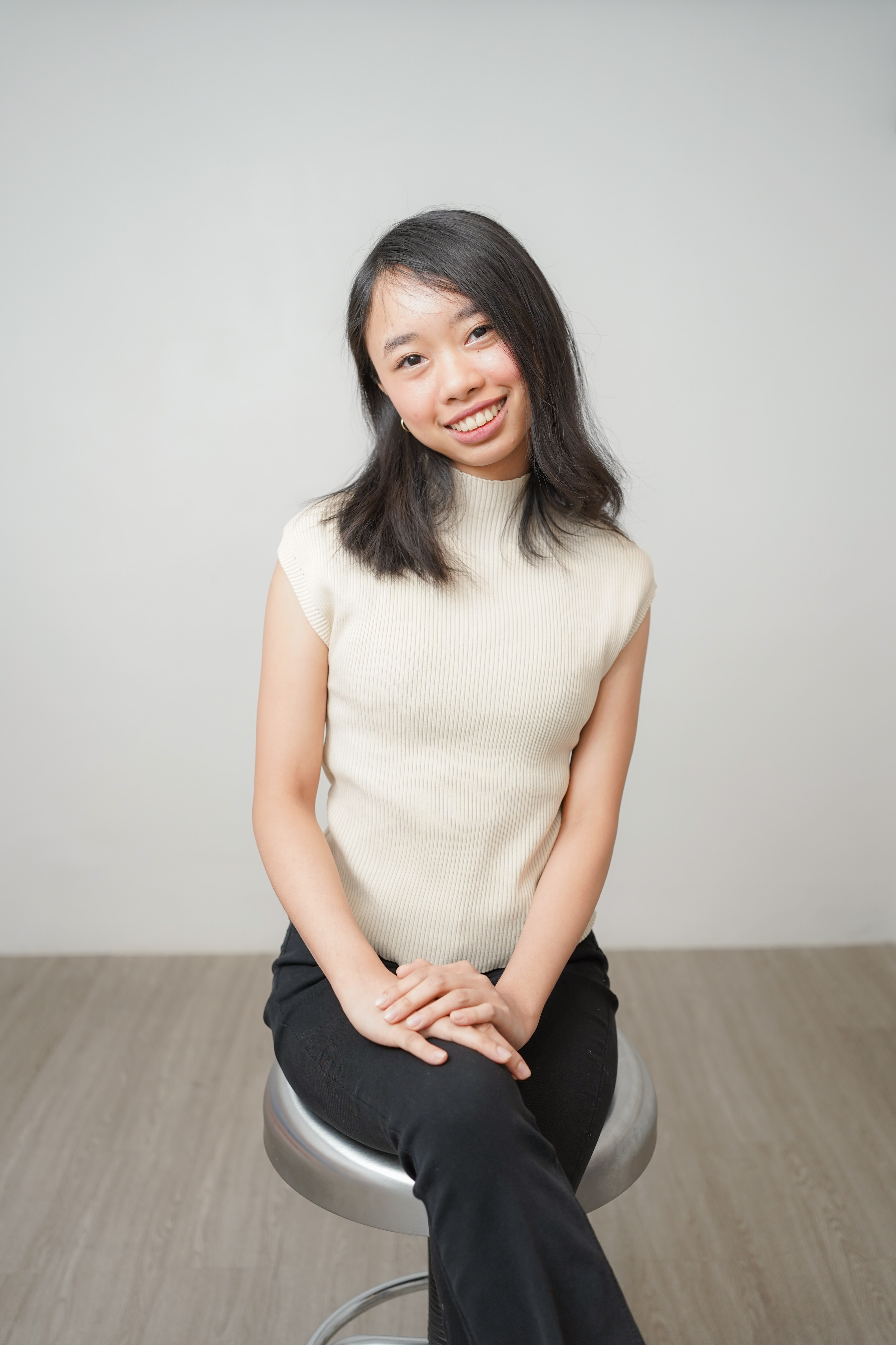 Portrait of Rain smiling at the camera.